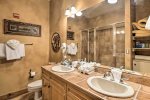 Master bathroom with dual sink vanity, separate shower and bathtub